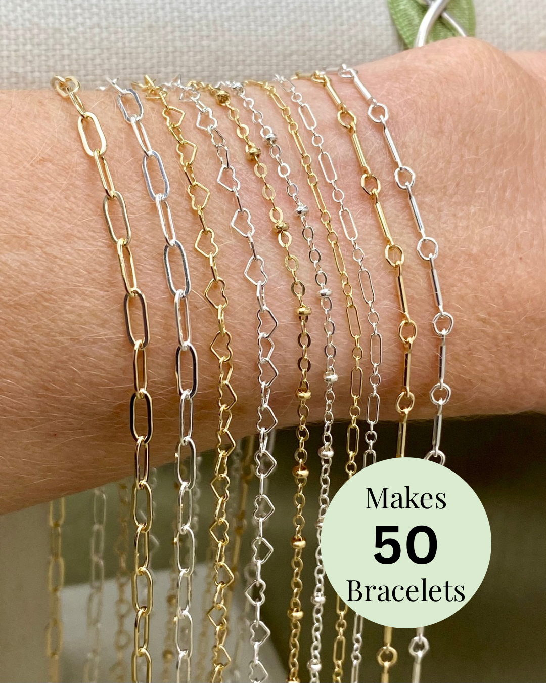 The Classic Pack S1 selection of permanent jewelry chains shown on wrist with makes 50 bracelets label